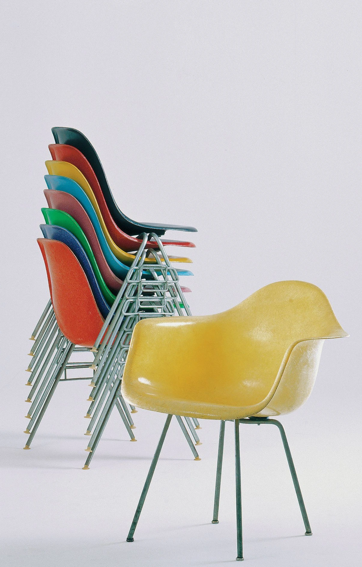 DSS stacking chairs and DAX armchair