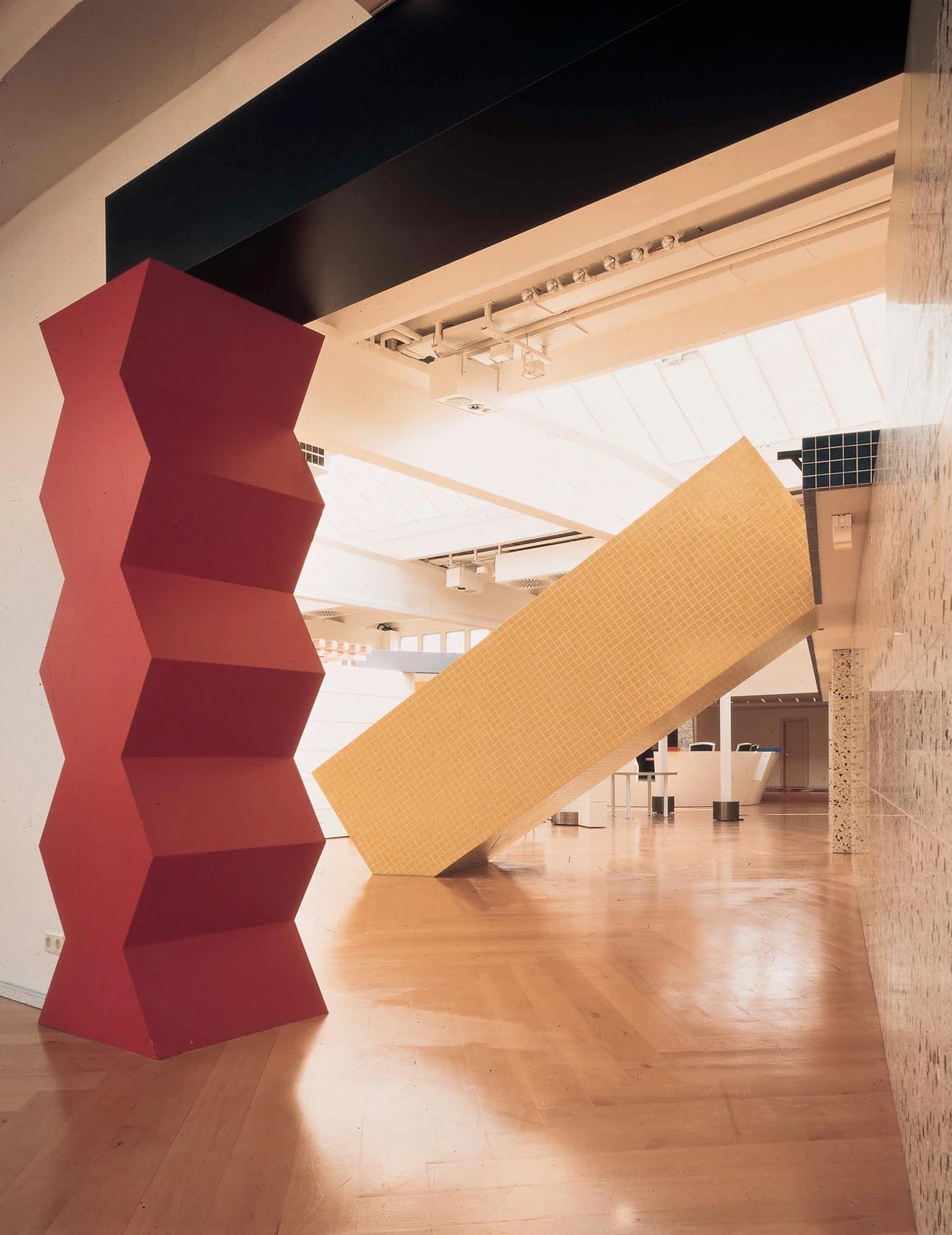 Interior of the Esprit showroom in Düsseldorf with red zigzag pillar in the foreground