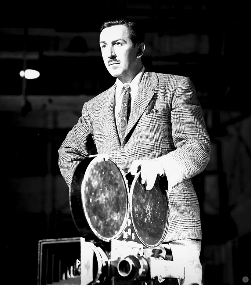 Walt Disney with a film projector