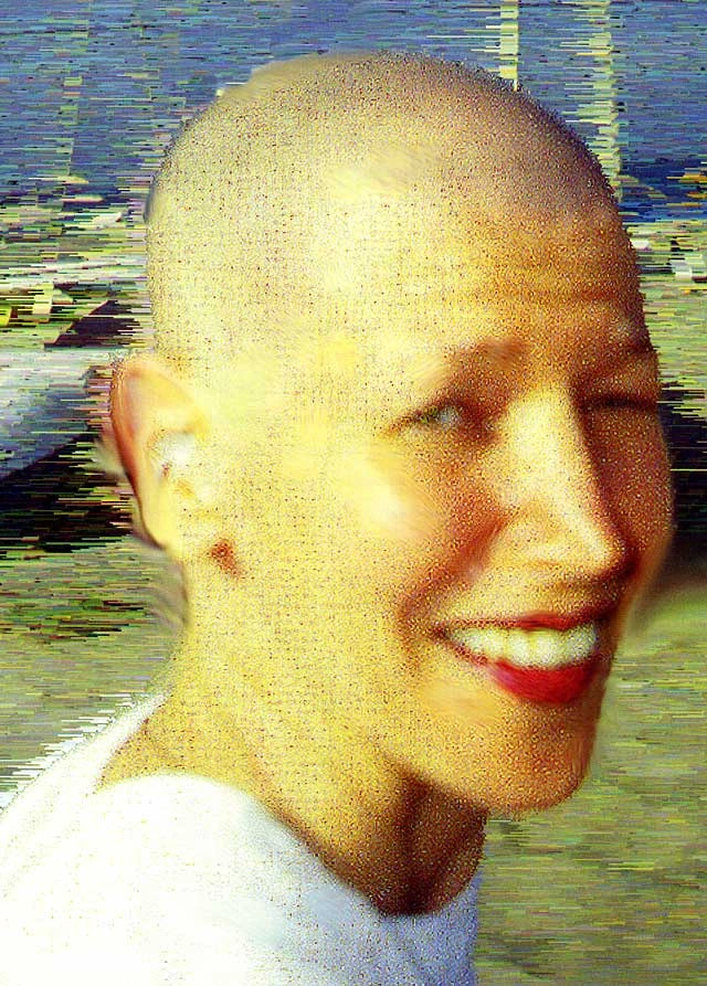 April Greiman, self-titled Bullethead. An artist with shaved head looking into camera