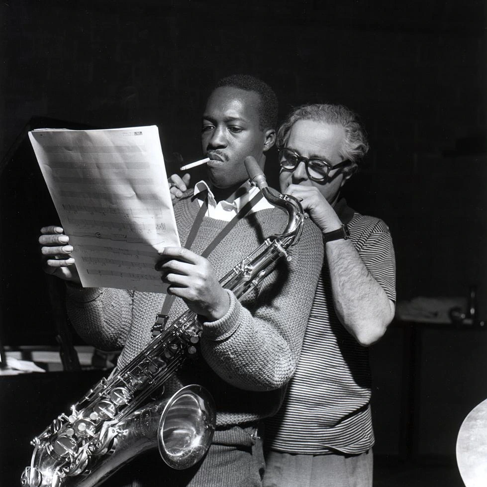 Hank Mobley and Alfred Lion stare at a music sheet together during Mobley&#x27;s Soul Station session