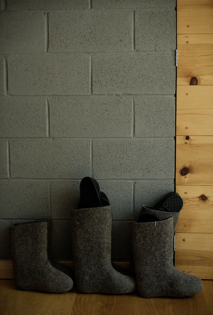 In the house of Anton Ioukhnovets and his family in Putnam Valley. Valenki and a grey brick wall