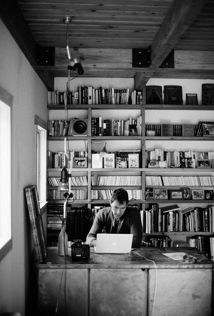 Anton Ioukhnovets working with a laptop in his house in Putnam Valley, NY