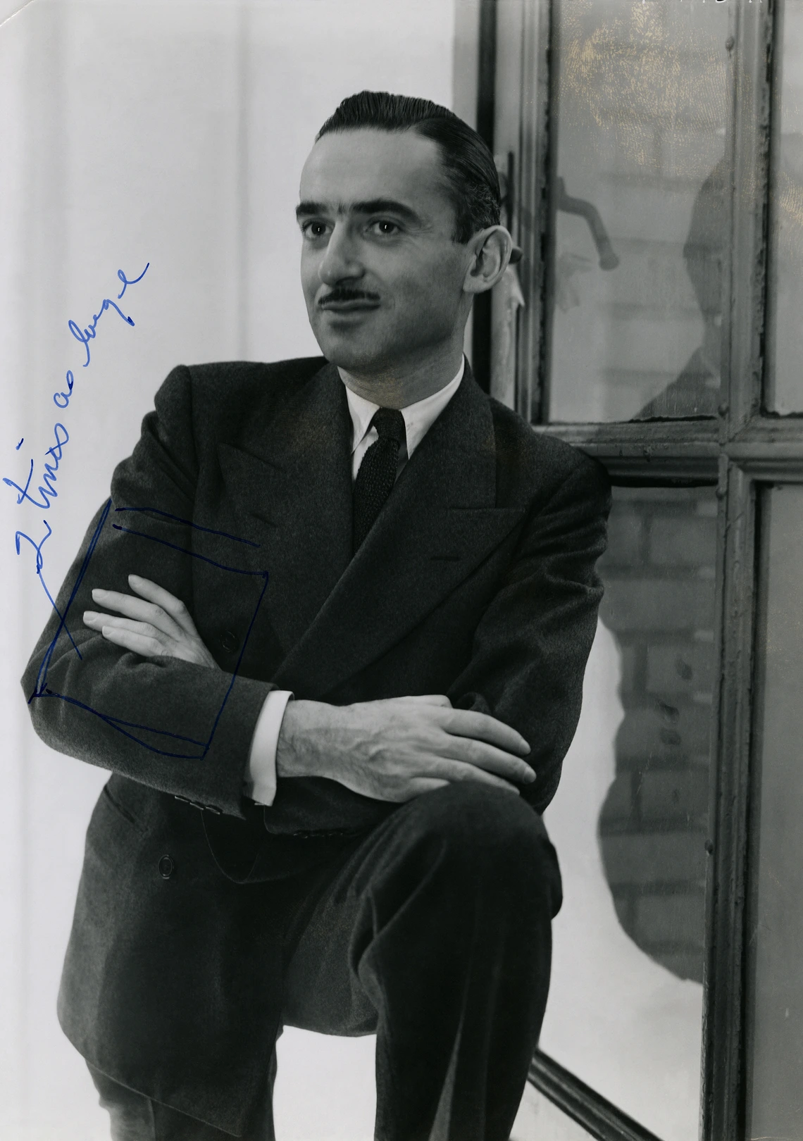 Alexander Liberman wearing a suit, looking sideways