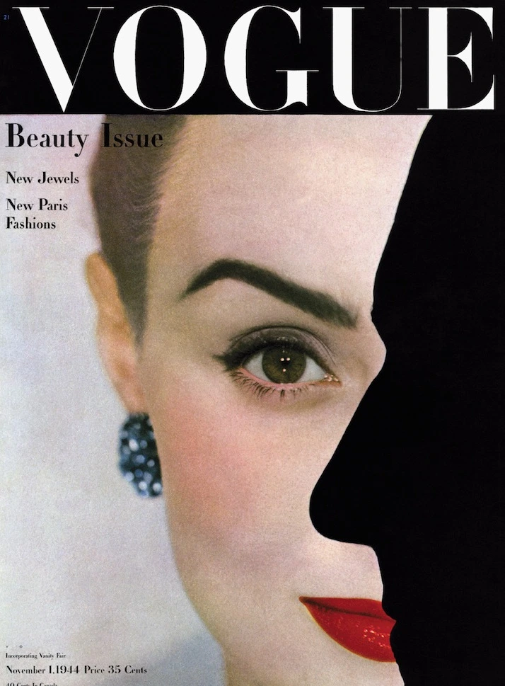 Vogue magazine cover, November 1944. A female face half-covered with a shadow of a man's face