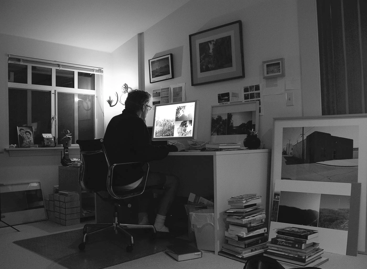 Rudy VanderLans working with photos in his home studio in Berkeley