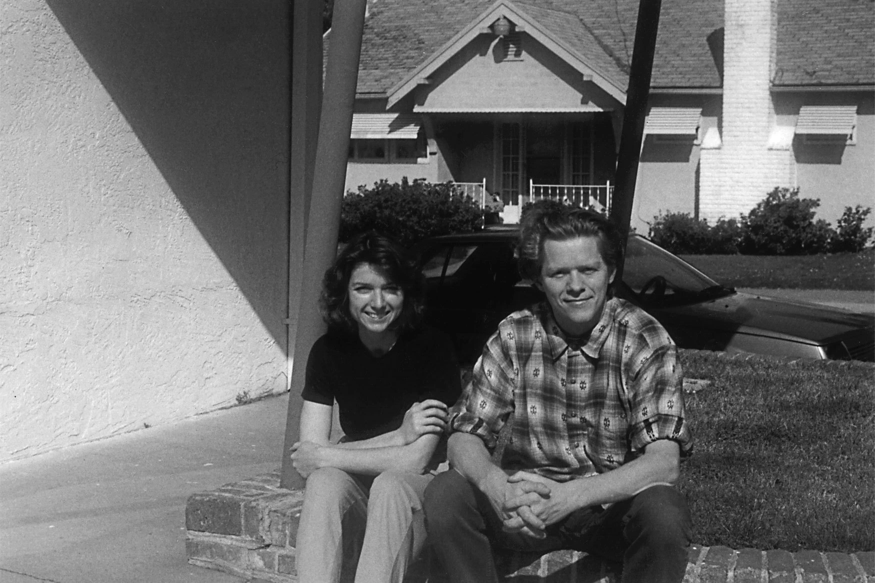 Zuzana Licko and Rudy VanderLans smiling and looking into camera