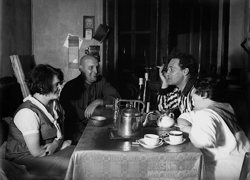 Four constructivists at the table, drinking tea. From left to right: Shub, Rodchenko, Gan, Stepanova