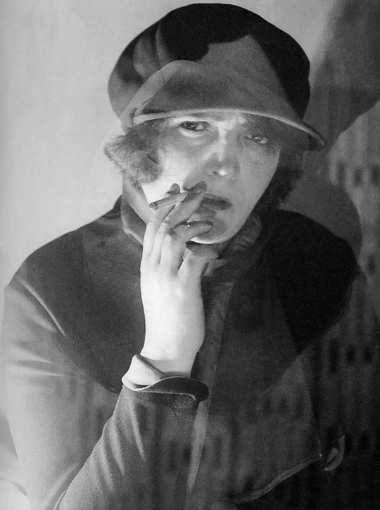 Esfir Shub smoking a cigarette, looking into camera