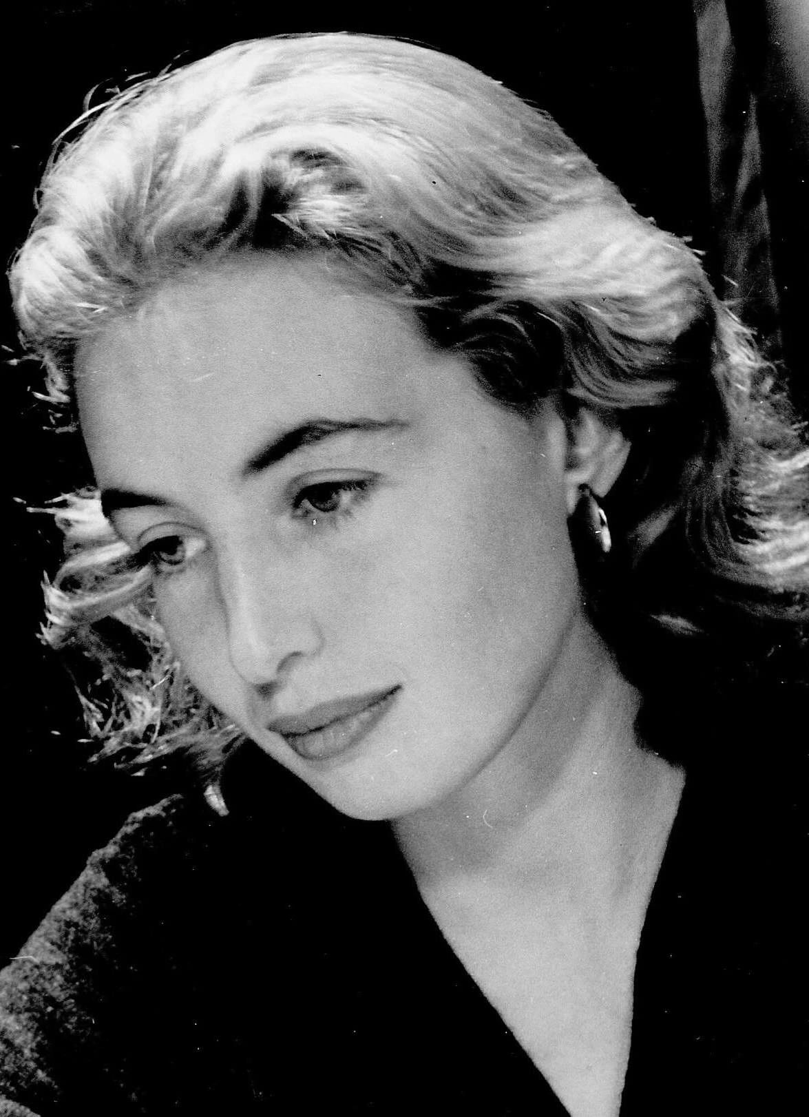 A photo of young Barbara Solomon, looking left