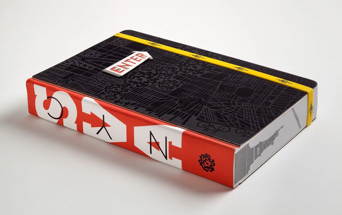 A brick of a book featuring work from students taught by Gail Anderson