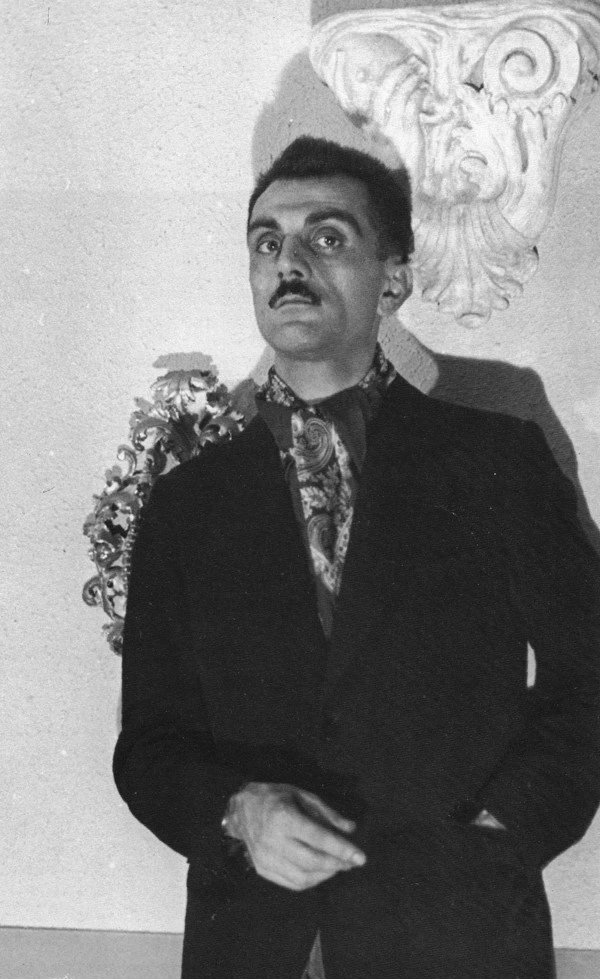 Carlo Mollino wearing a suit