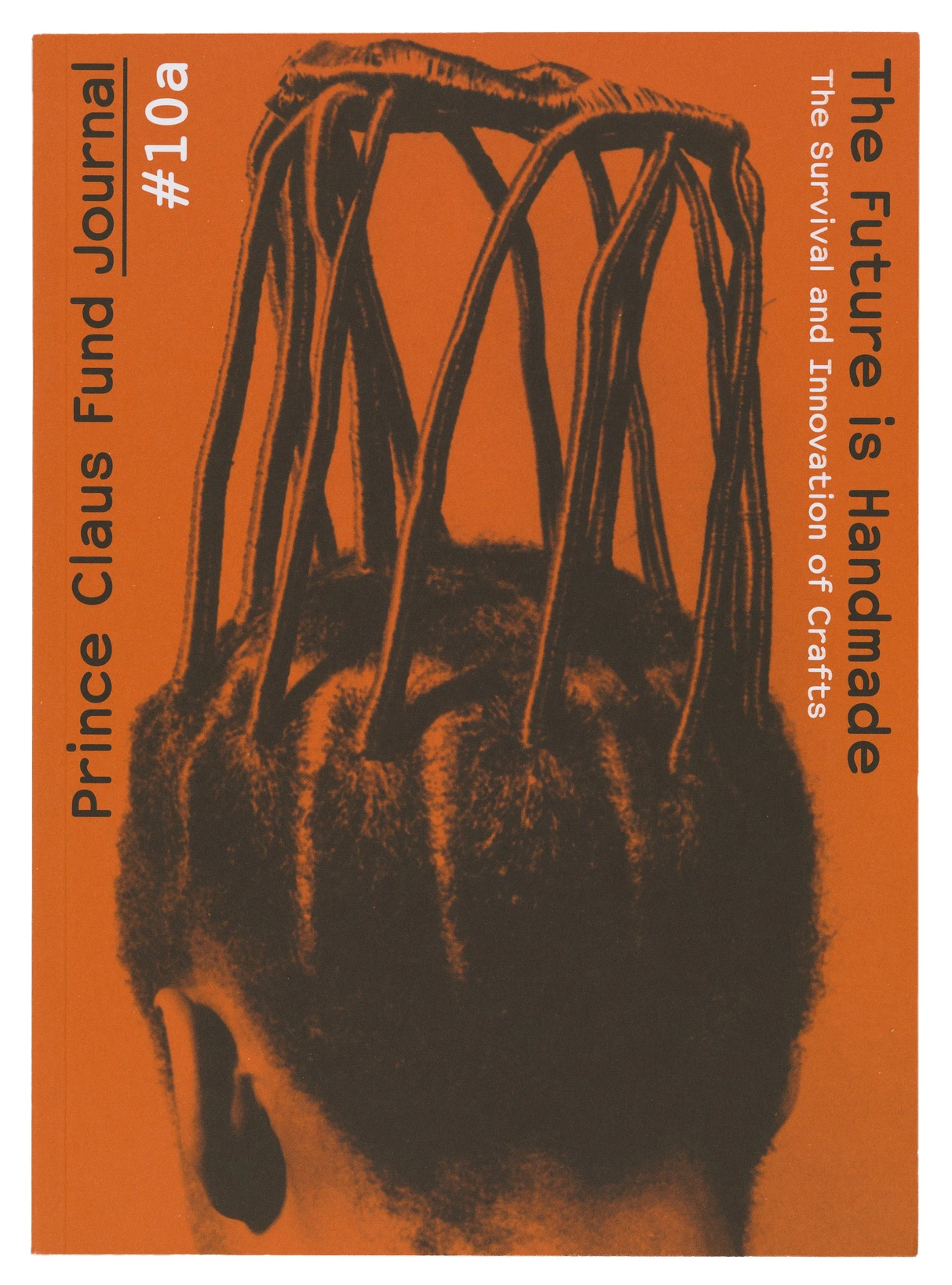 SHV Think Book designed by Irma Boom. A head with a weird hairdcut on an orange background