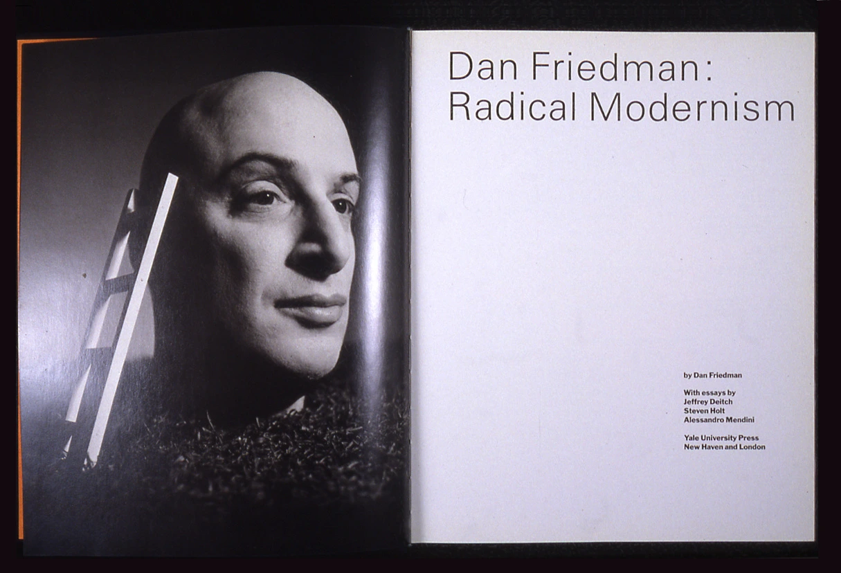 Interior spread of Dan Friedman: Radical Modernism. Friedman's head with a ladder attached to it