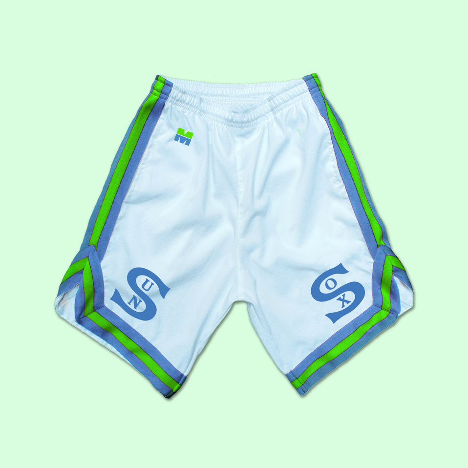 White basketball shorts for the brand SUNSOX. The shorts have green and blue stripes on the sides and feature the Miami Made M logo.