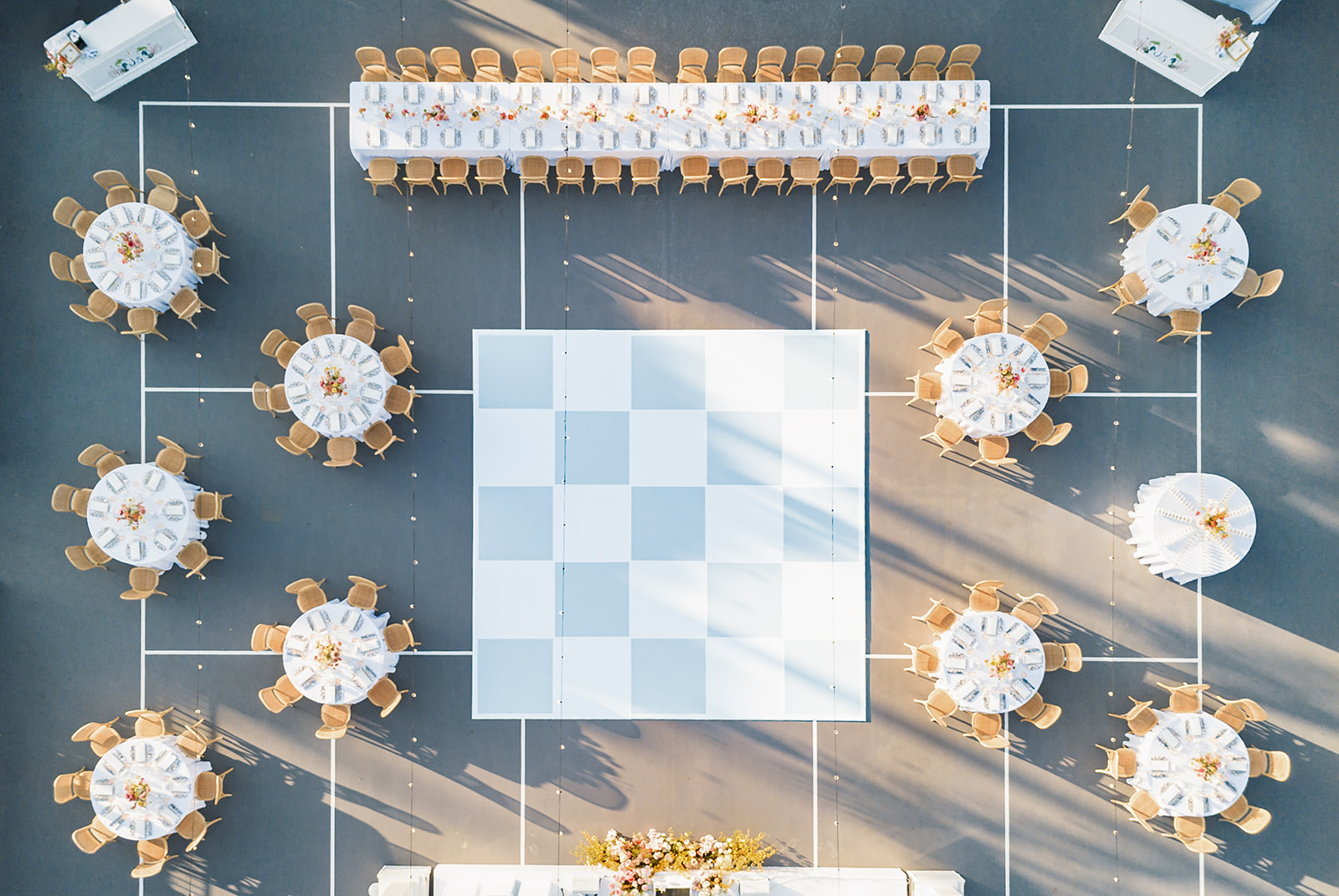 Newlyweds sharing a candid embrace during sunset at a vineyard in Montecito. Fine art wedding photographer with film expertise Santa Barbara.