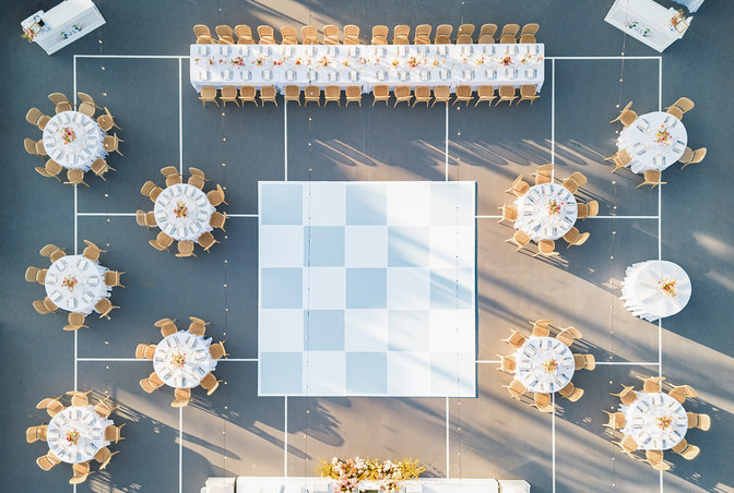 Newlyweds sharing a candid embrace during sunset at a vineyard in Montecito. Fine art wedding photographer with film expertise Santa Barbara.