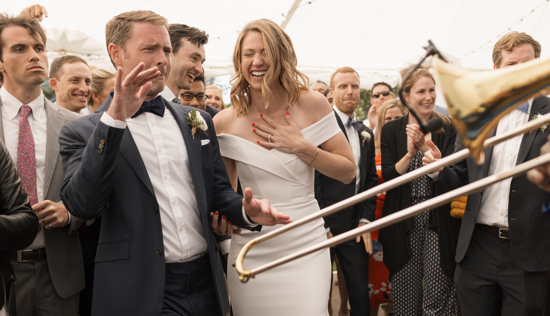 Bride and groom laughing and dancing to a live band at a Montecito wedding reception.