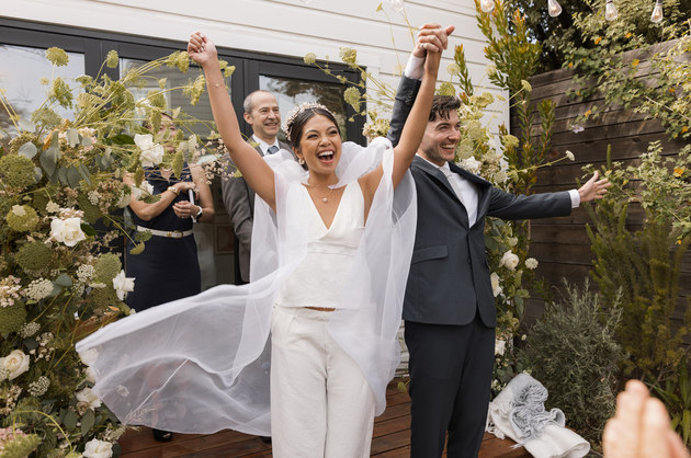 Joyful, candid moment between the bride and groom, captured during their wedding ceremony at a historic home in San Francisco.