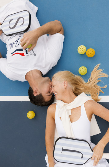 Drone shot of intimate outdoor poolside wedding ceremony at Laguna Beach hotel.