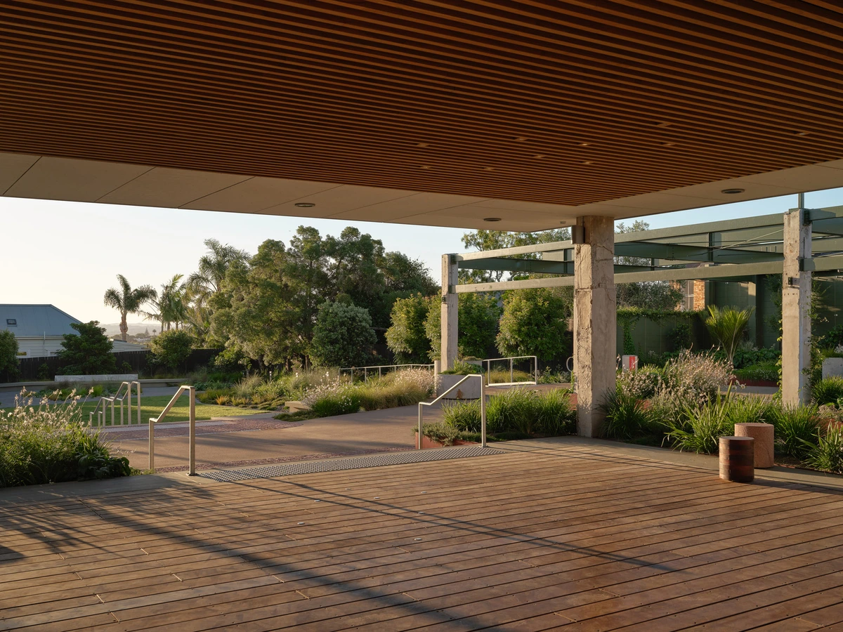 Te Rimutahi, Ponsonby: a timber-lined civic canopy above paving, grasses and native planting