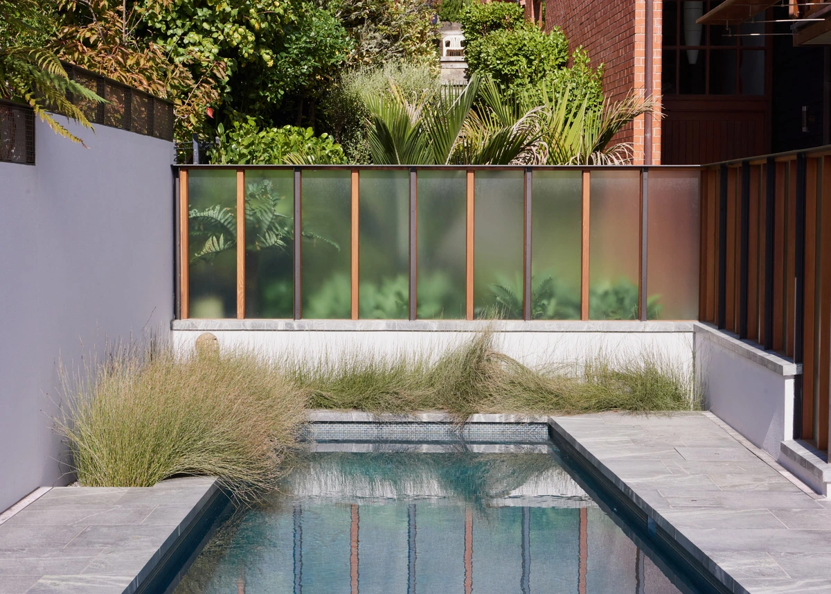 St Leonard's, Mount Eden: layered native planting and wharariki beside a lap pool