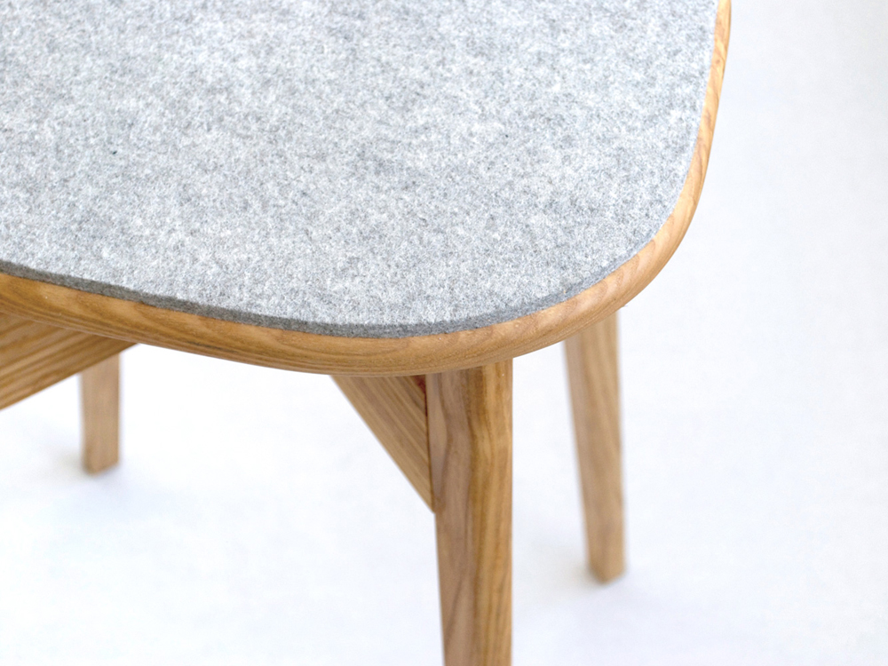 Detail of felt top of  counter hieght stool designed by Jenna Hill