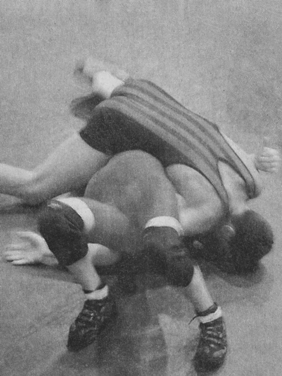 Untitled. (wrestlers #3) from Dark Matter by Ron Jude