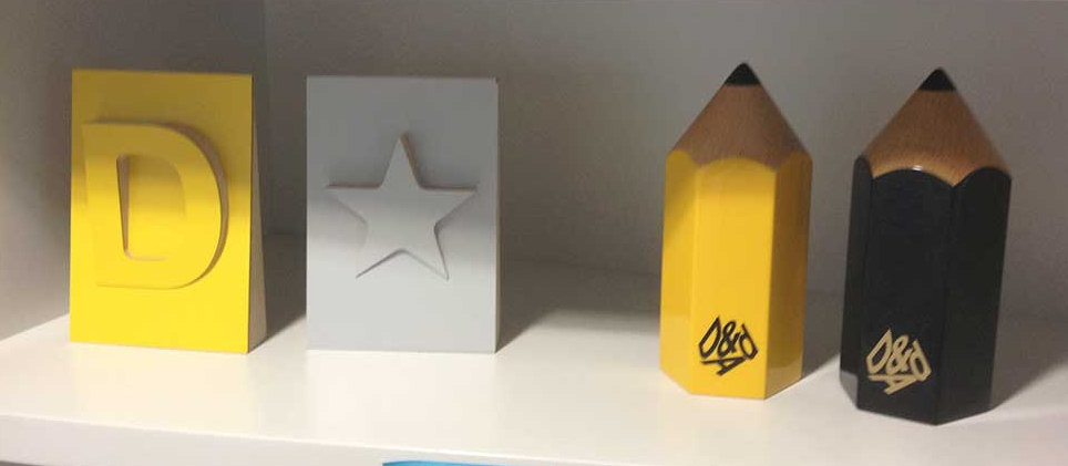 A shelf in the GDS office displaying various awards.