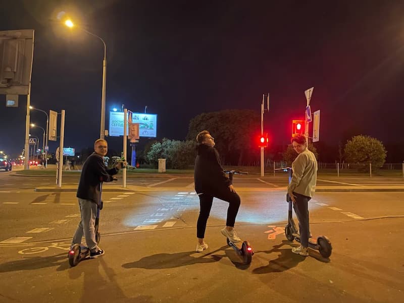 Part of the 69pixels team rides together on electric scooters after a hard day's work