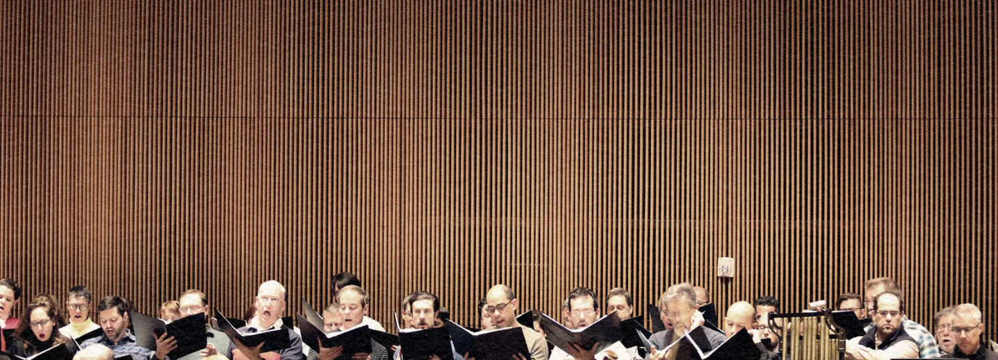Creative filmmaking for the ASO: A minimalist composition of the American Symphony Orchestra chorus inside the iconic Fisher Center, highlighting Gehry’s unique architecture