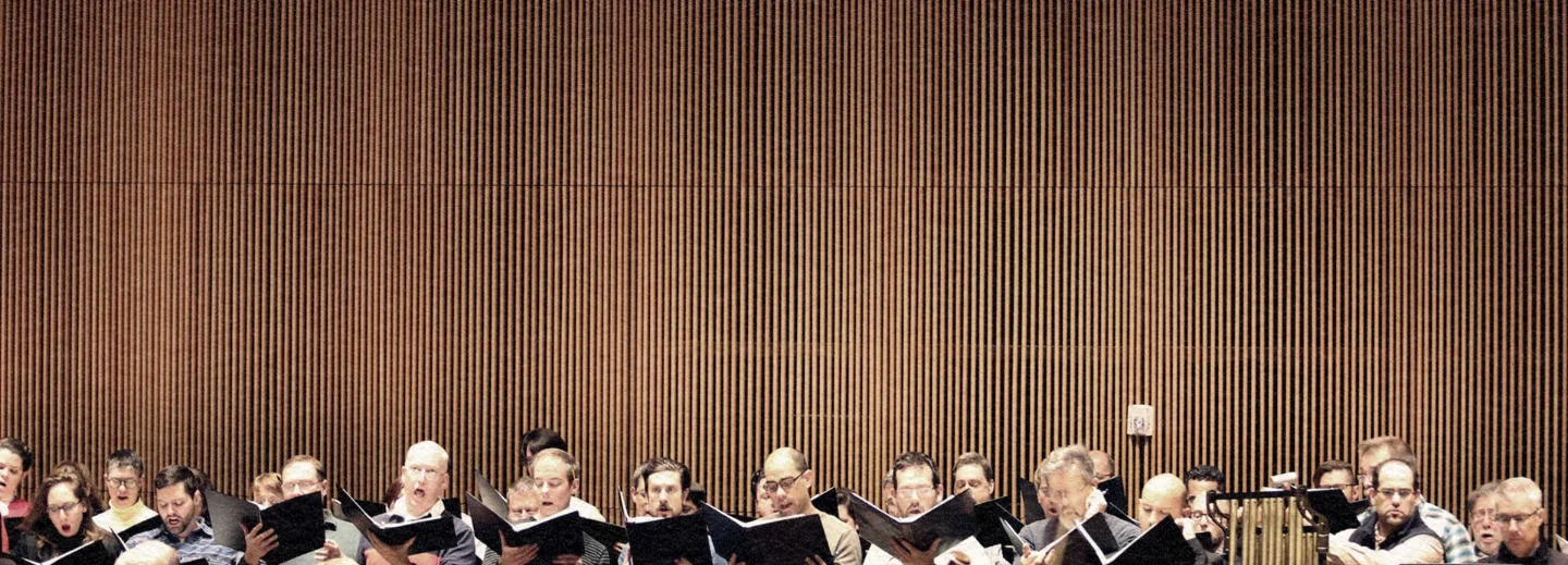 Creative filmmaking for the ASO: A minimalist composition of the American Symphony Orchestra chorus inside the iconic Fisher Center, highlighting Gehry’s unique architecture