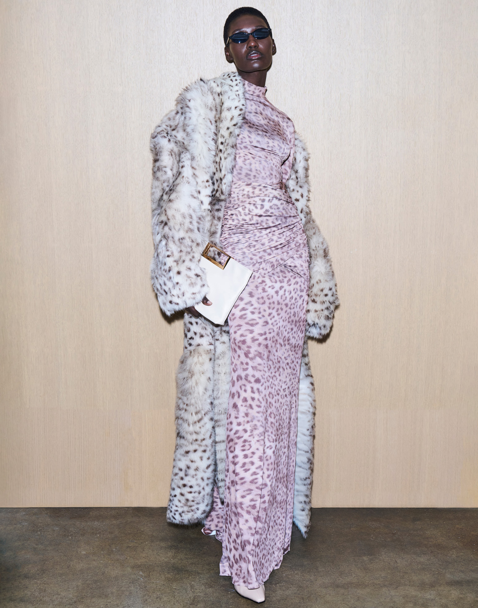 LaPointe — fashion campaign image featuring model in leopard-print dress and fur coat, photographed by Kourosh Sotoodeh.”