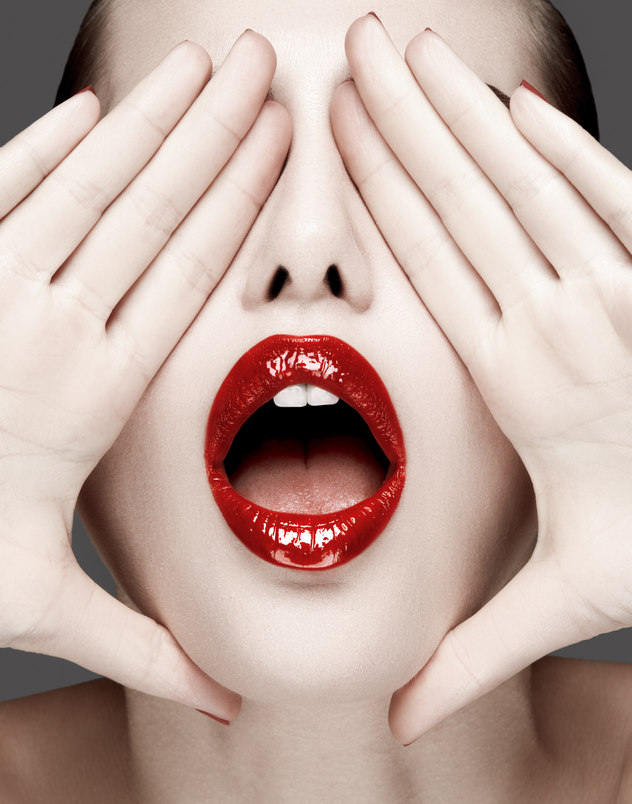 Harper’s Bazaar Serbia — beauty editorial close-up with red lips and hands covering eyes, photographed by Kourosh Sotoodeh.