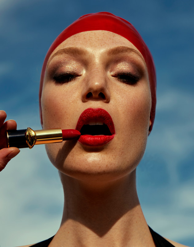 Marie Claire Serbia — beauty editorial close-up with red lipstick application, photographed by Kourosh Sotoodeh.