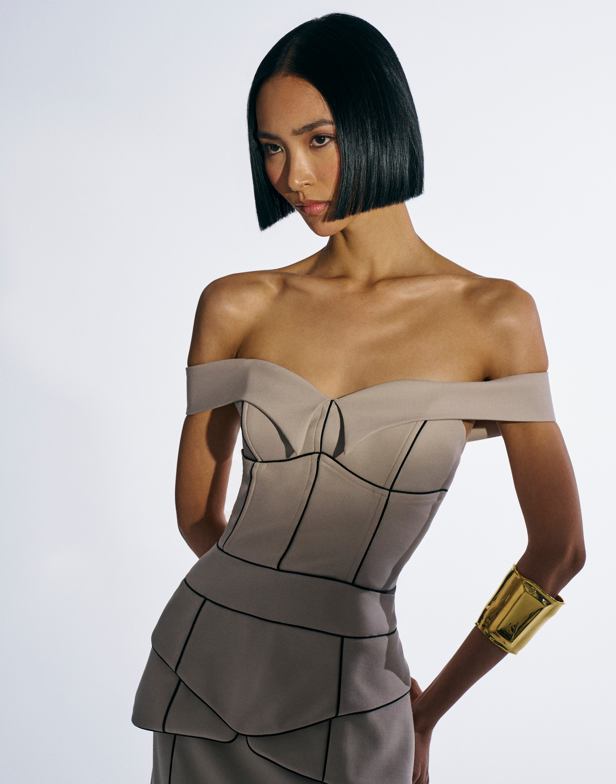 Grace &amp; Clyde Spring Launch Campaign — studio fashion portrait of model in structured off-shoulder look, photographed by Kourosh Sotoodeh.

