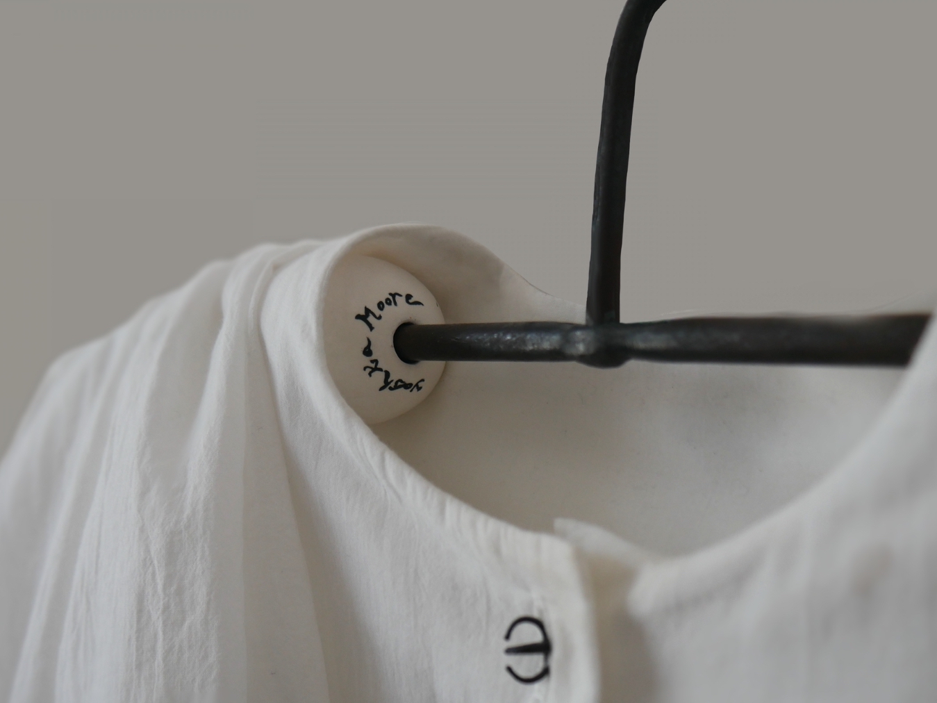 Yashka Moore beads iron and porcelain clothes hanger