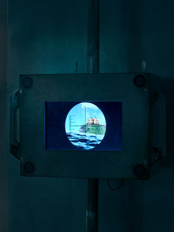 Simulated submarine periscope installation showing the Children’s Museum of Costa Rica represented as an island