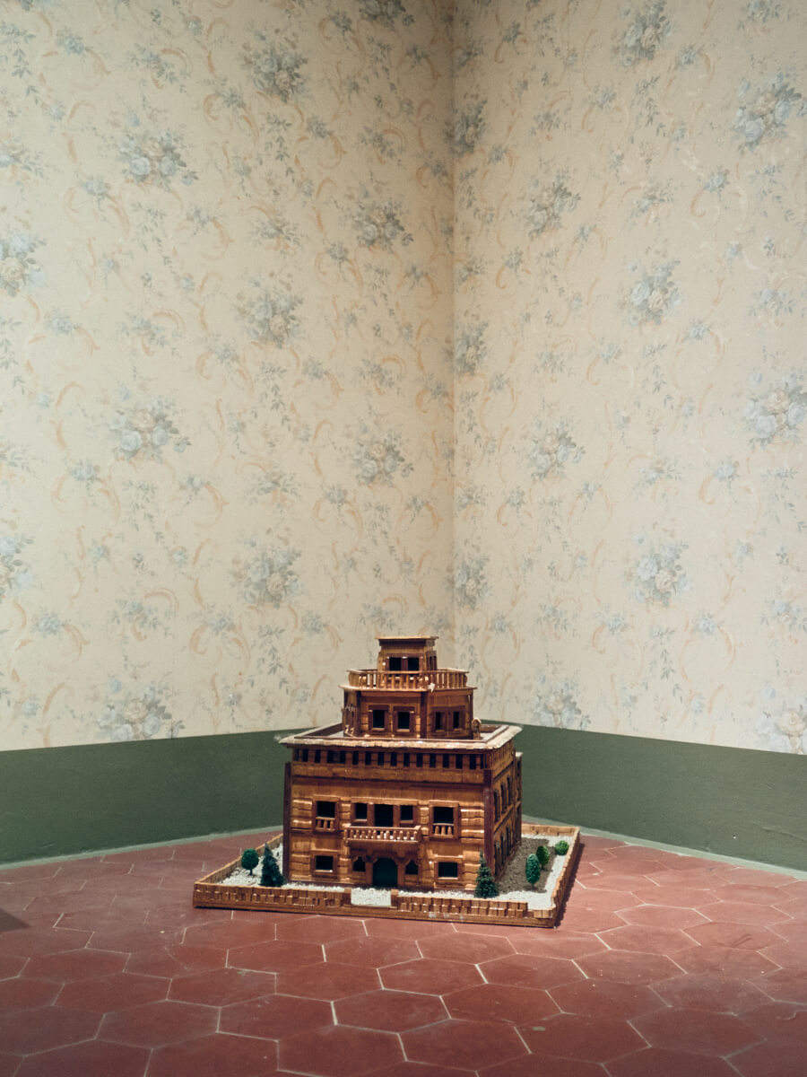 Scale model of the factory owner’s house positioned above the textile colony, asserting authority over the surrounding buildings